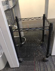 Black Metal Stand on wheels