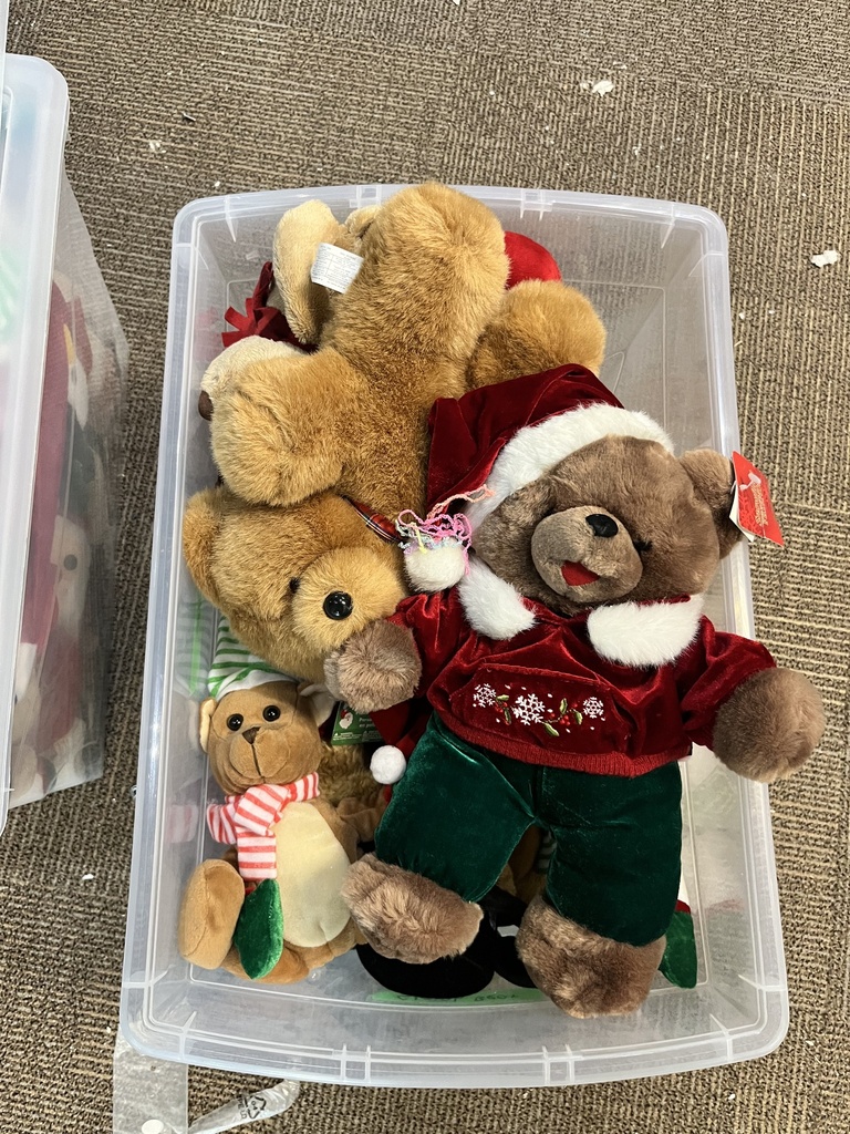 Bin of Christmas-themed stuffed animals