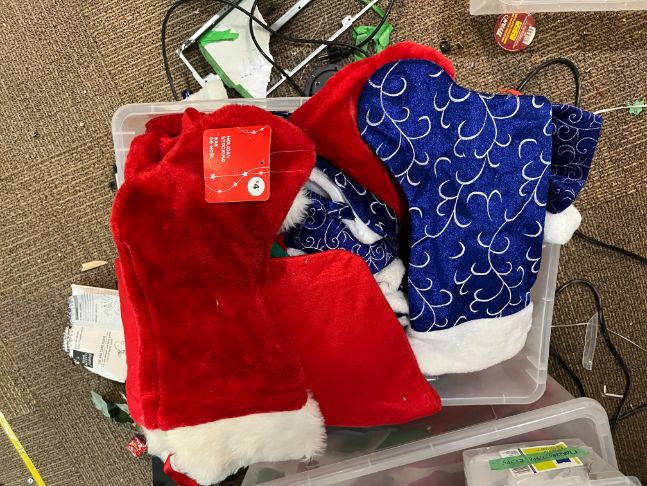 Bin of Christmas stockings, misc.