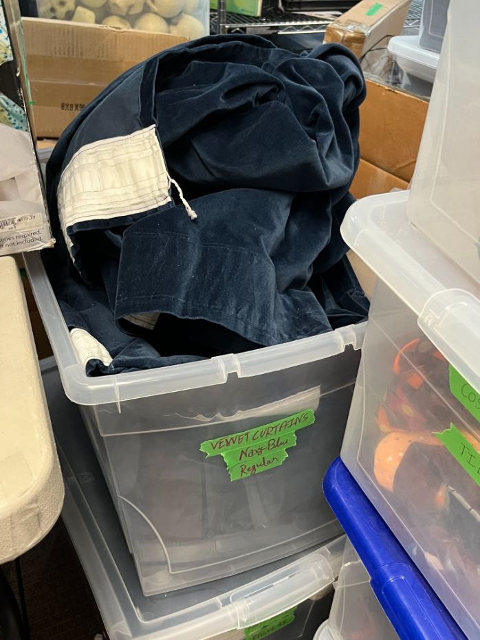 Bin of velvet curtains, navy blue
