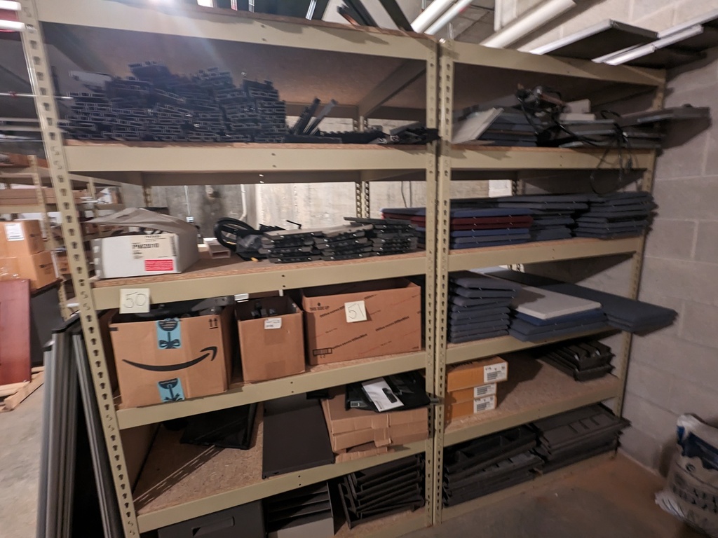 metal rack contents (workstation parts, tackboards, boxes, metal frames, etc.)