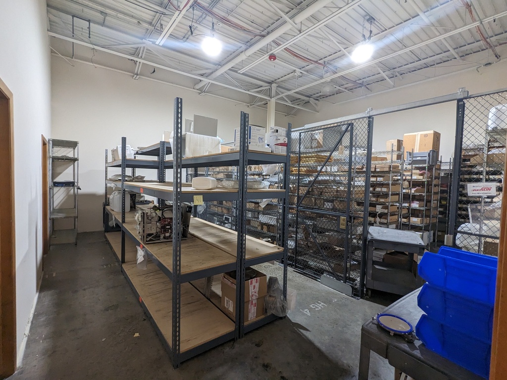 grey metal racking with partical board shelves, 4-high