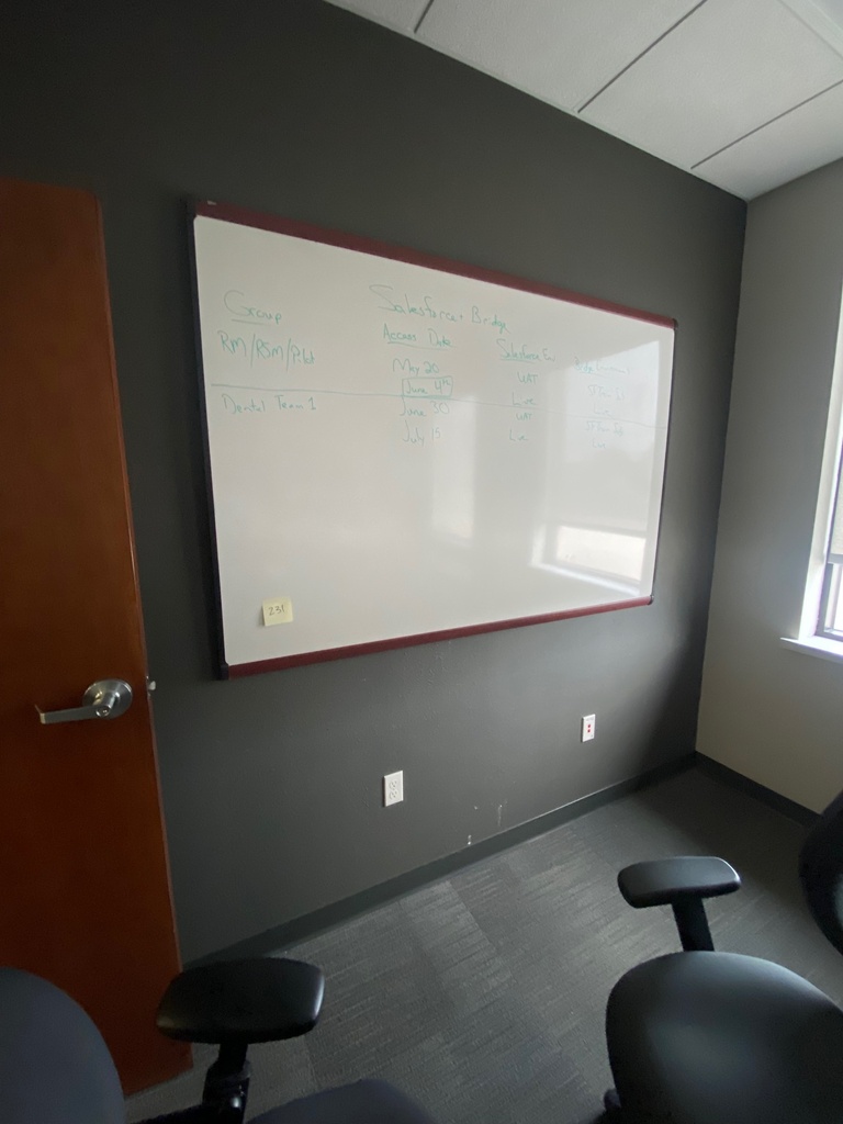 large whiteboard with wood frame