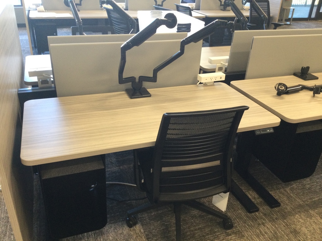 Light Wood electric sit stands with dual monitor arms   28x58x28 lowered 