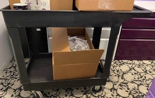 Black plastic cart on wheels