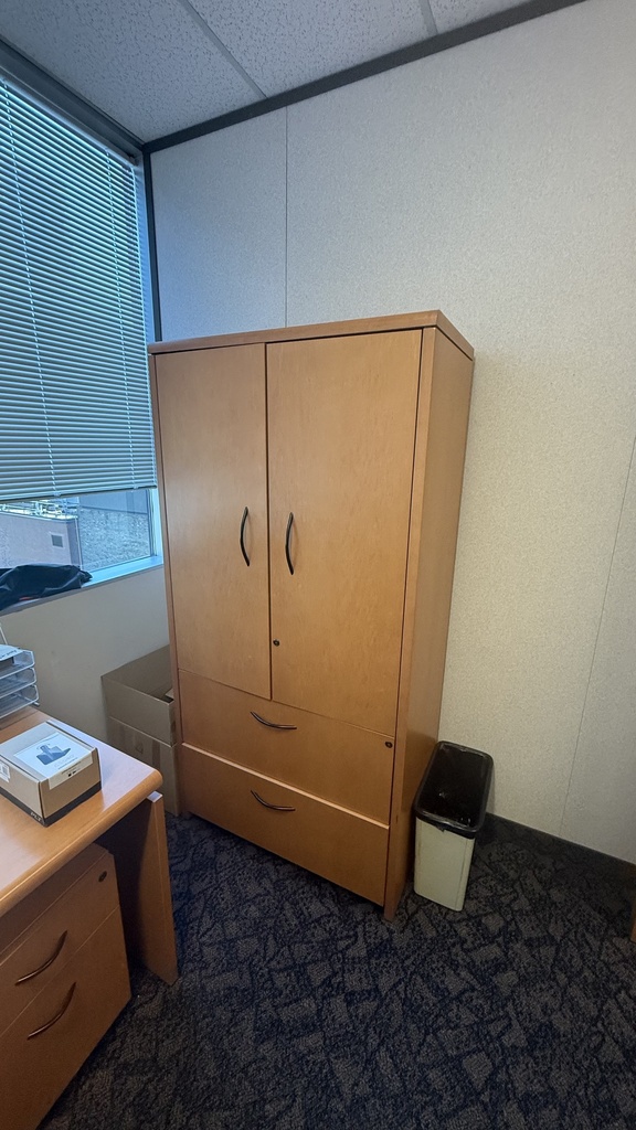 Tall storage wooden cabinet with two vertical doors and two lower drawers