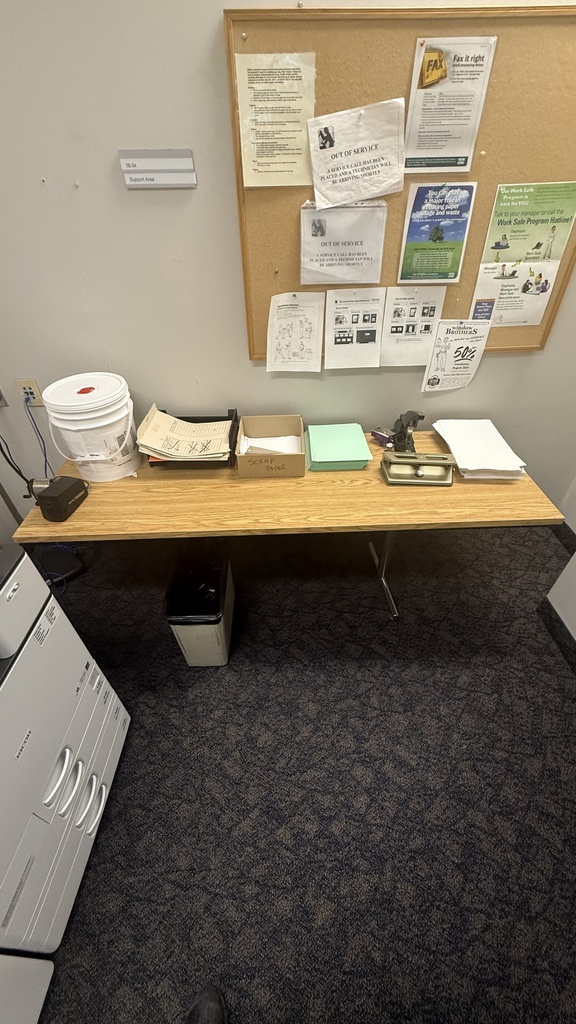 Large office desk with yellow wooden top and metal legs