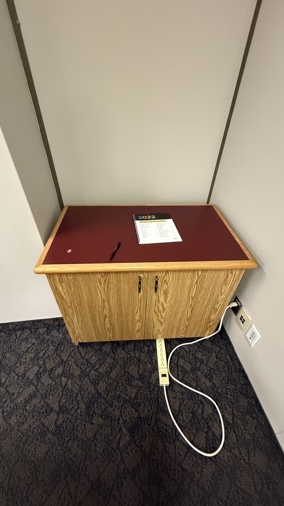 Compact, freestanding wooden storage cabinet with two hinged doors