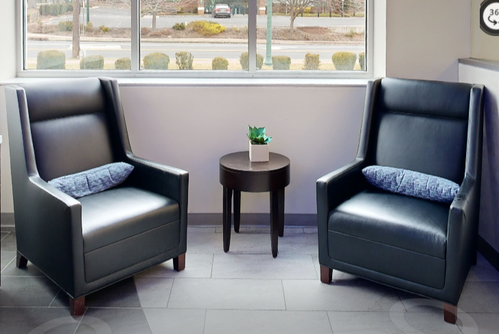 Tall-back black lounge chairs
