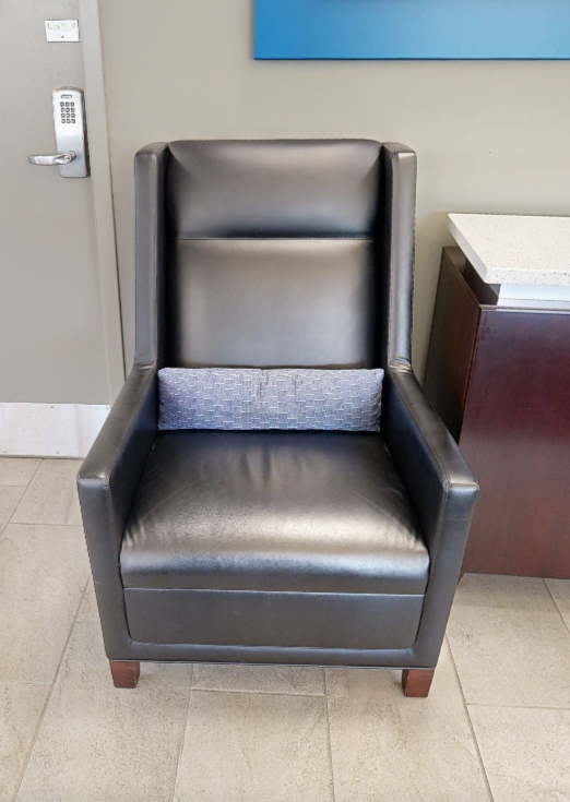 Black tall-back lounge chair