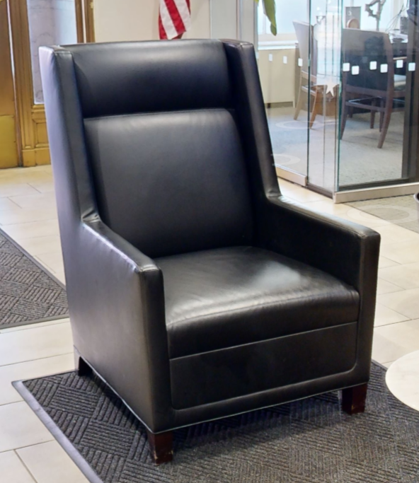 Black tall-back lounge chair