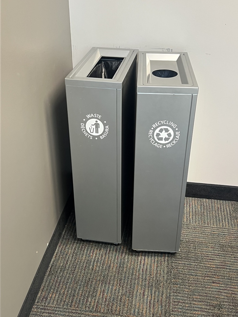 Grey metal recycling bin