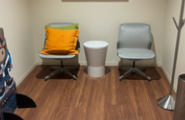 LOUNGE CHAIRS AND SMALL WHITE TABLE AND COAT ROD