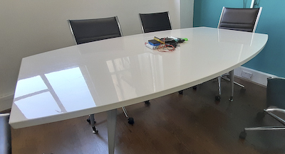 Cut oval white meeting table