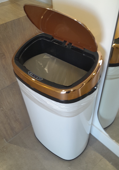 White electric flip to bathroom bin 