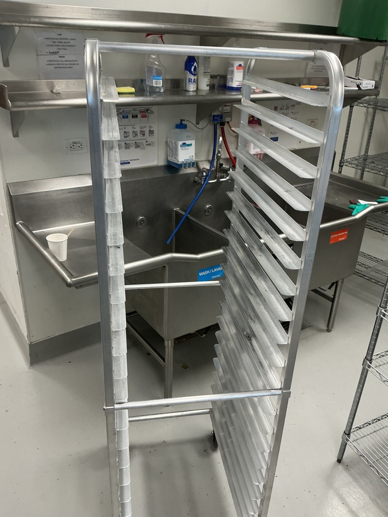 Serving rack with slots for cooking sheets. Mobile. 