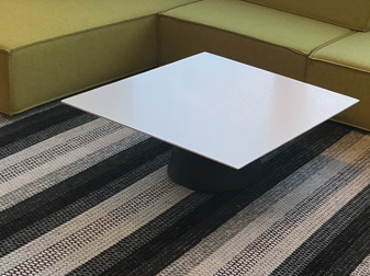 Coffee table white with a black base 