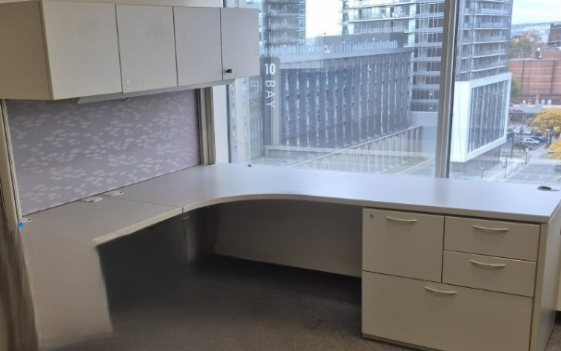 L-Shaped Grey Office Suite with overhead