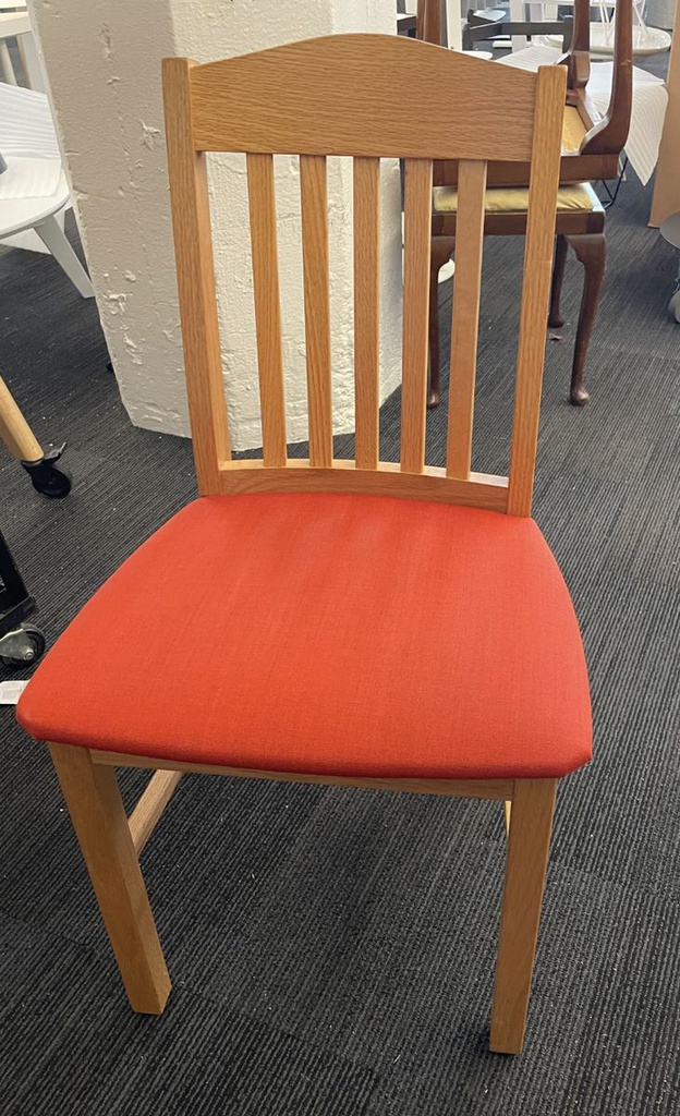 Orange cushioned wood chair