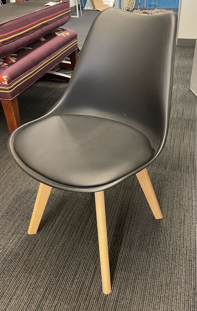 Black cushioned plastic chair