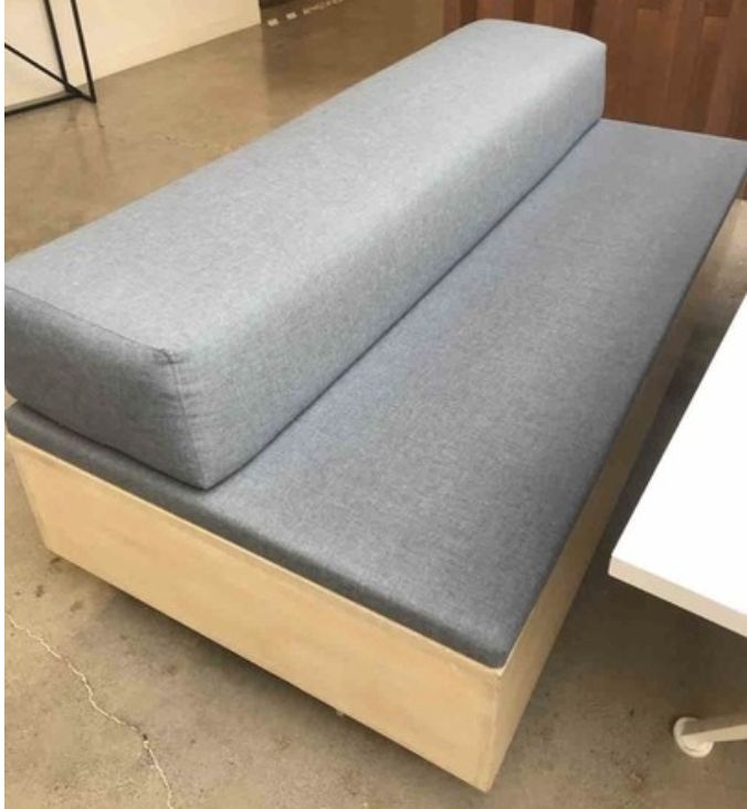 Upholstered bench on casters