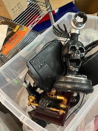 [#I2-69] Bin of Halloween-themed phones