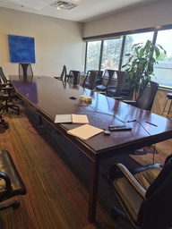 [#C7-4] Dark wood board room table