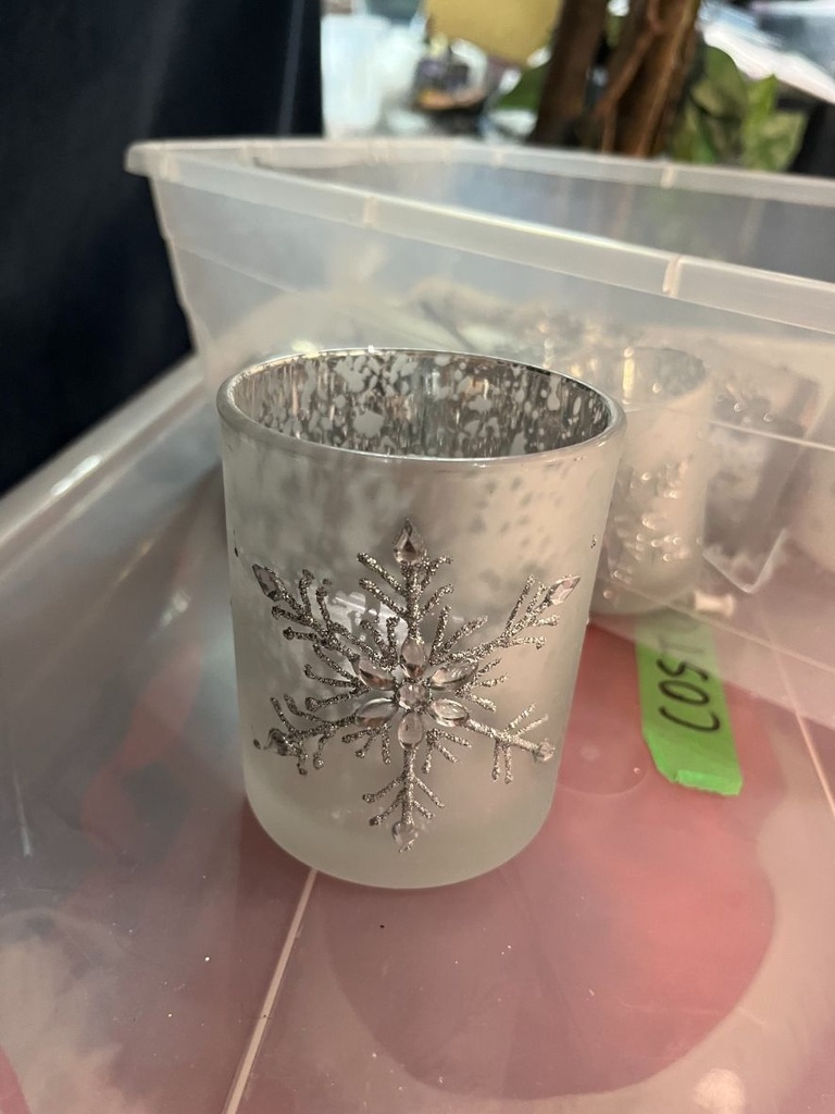 Bin of Christmas-themed candle holders