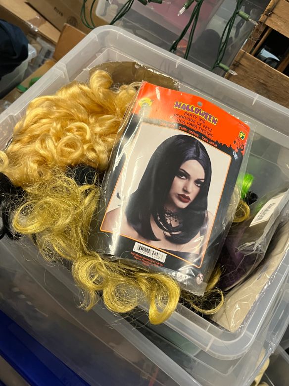 Bin of wigs