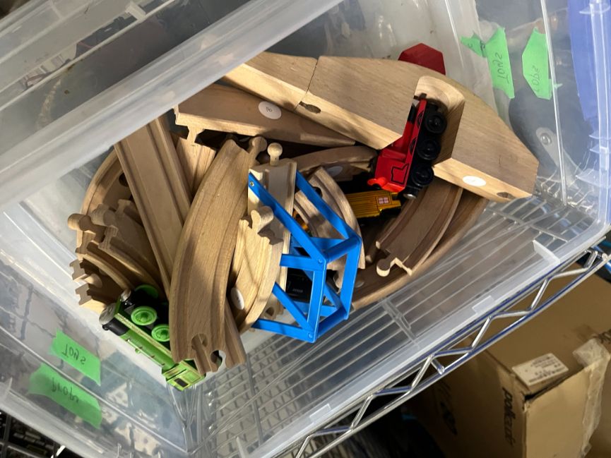 Bin of toy trains and tracks, misc.