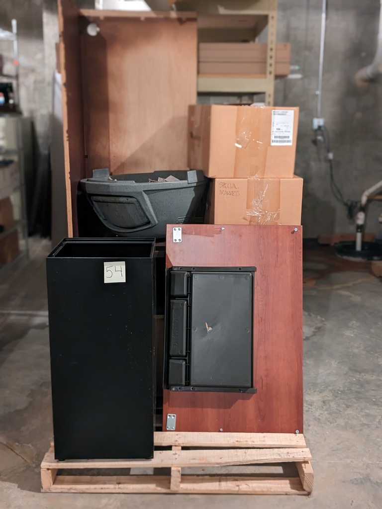 pallet of misc office furniture (desk shell, waste bin, etc.)