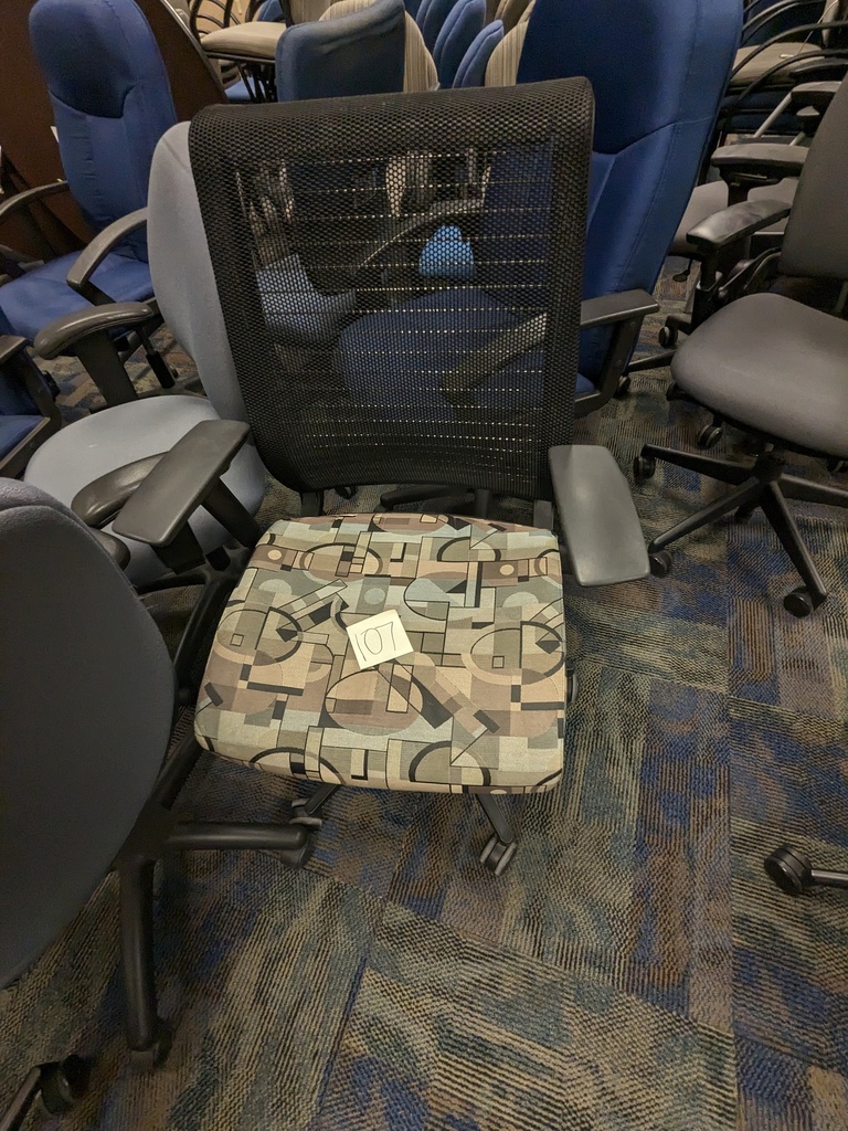 geometric pattern task chair - swivel base, mesh back, upholstered seat, adjustable arms