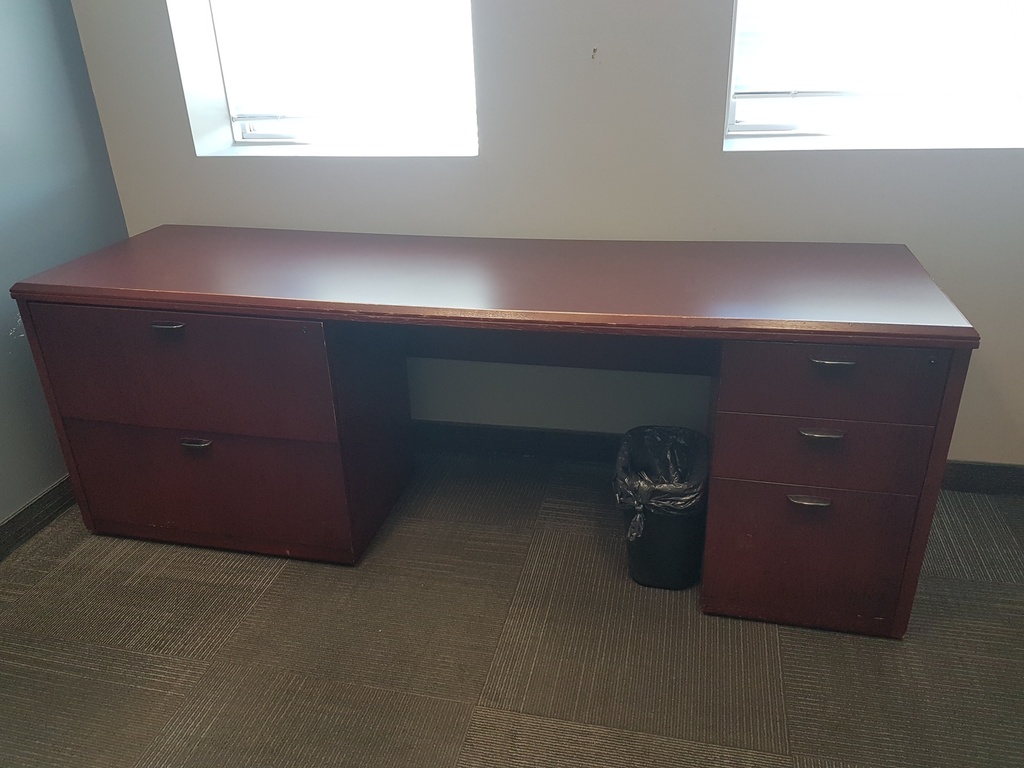 Large wooden desk with two pedestals