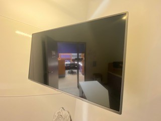 LG TV, wall-mounted