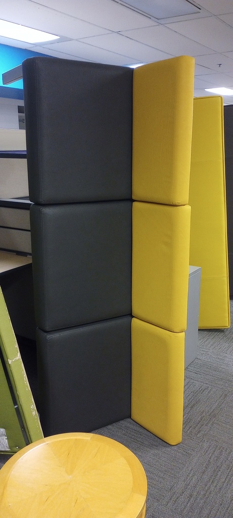 large black/yellow leather couch with metal feet