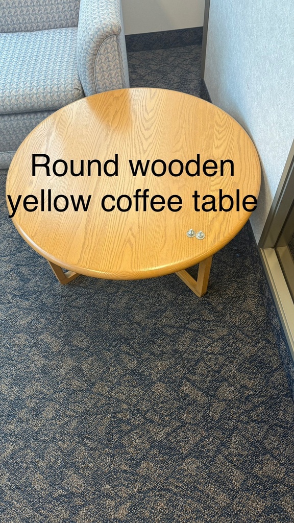 Round wooden coffee table with yellow wooden top