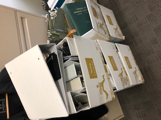 boxes with binders and filing tabs