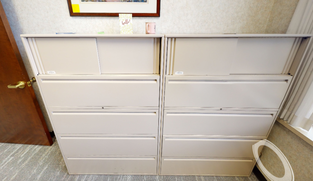 4 Metal filing cabinets in offices