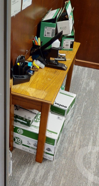 1 Small table holding office supplies