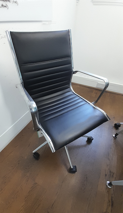 Black faux leather meeting chair