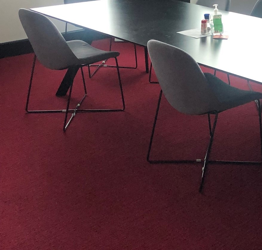 Black chairs around black table